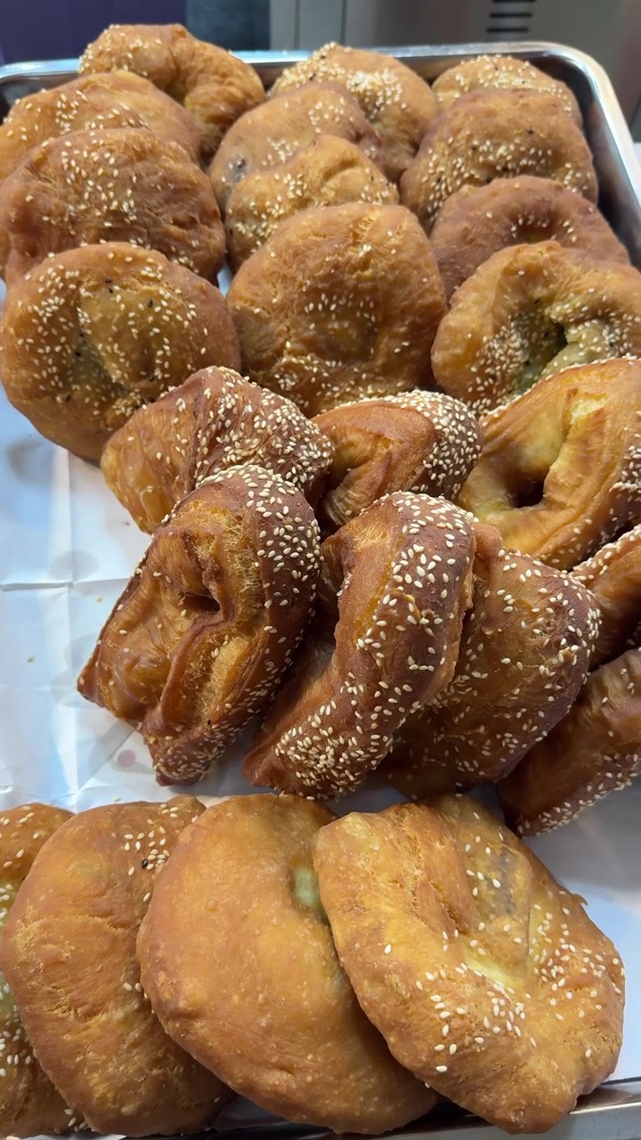 Freshly Fried Sesame Seed Pastries on a Metal Tray