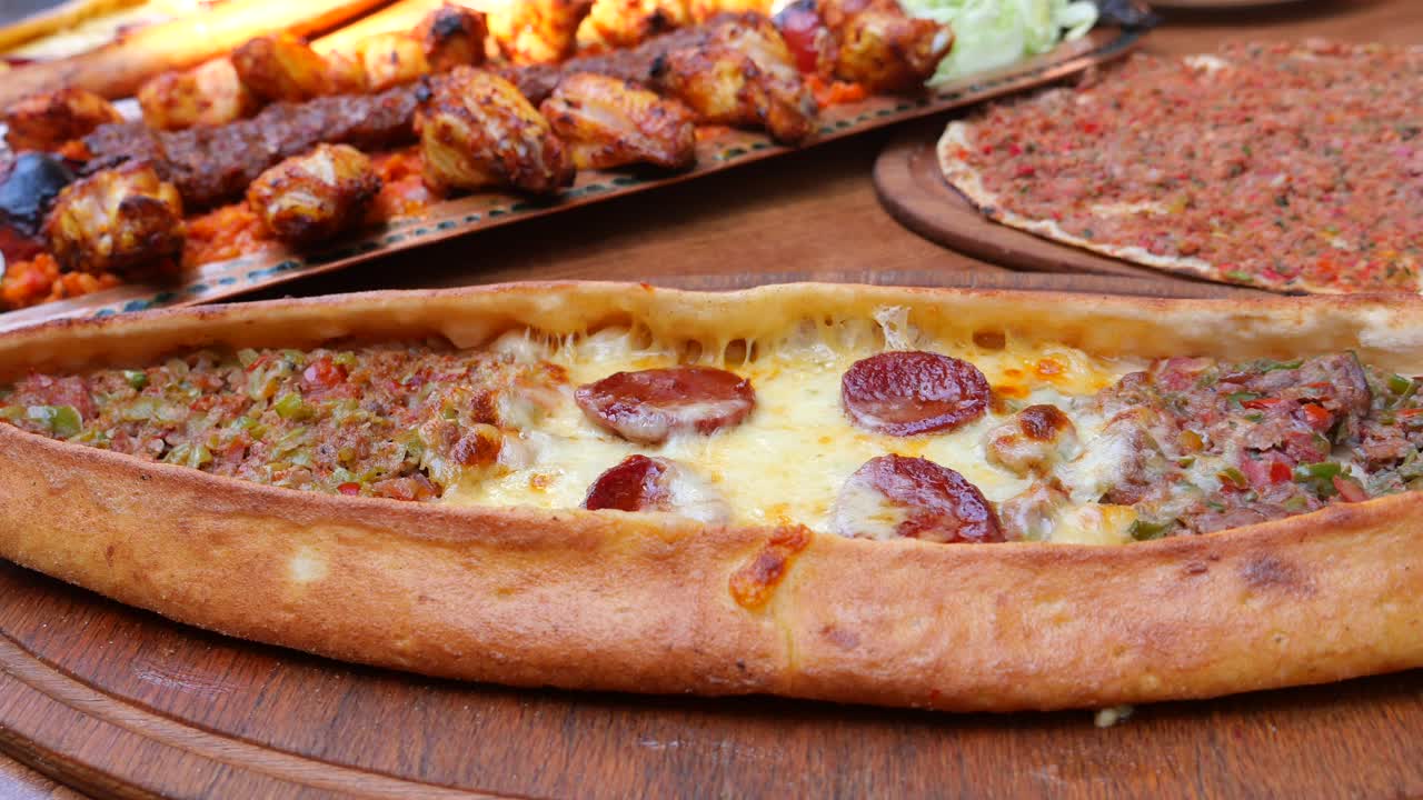 Assortment of Turkish dishes including pide, lahmacun and kebab
