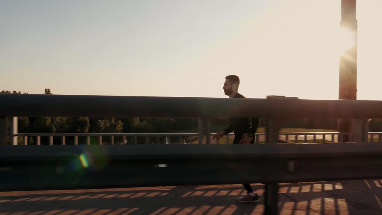 Man Running on a Bridge at Sunset