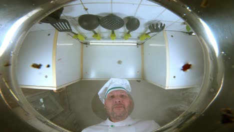 chef throws pasta in a pot of boiling water, the view from the pan.