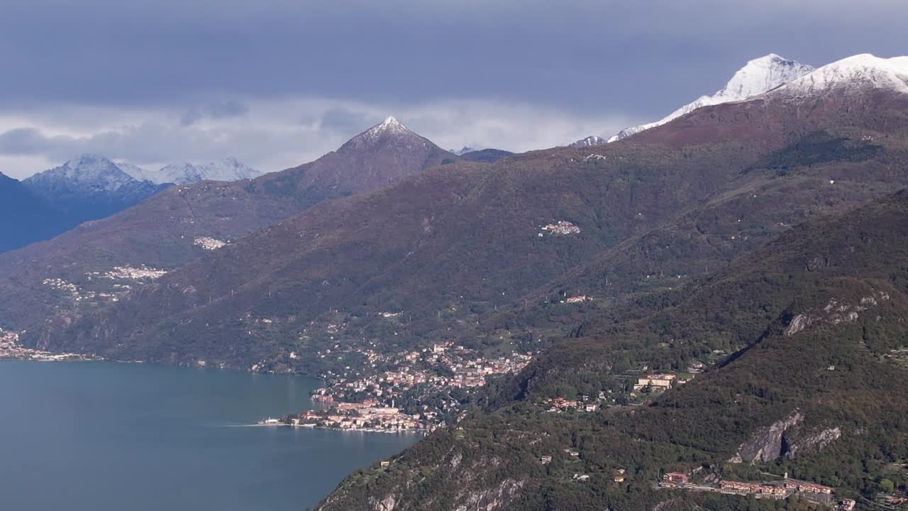 Stunning aerial view of the Alps and serene lakeside villages in Italy