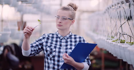 Botanist-Examining-Plants-At-Greenhouse-15