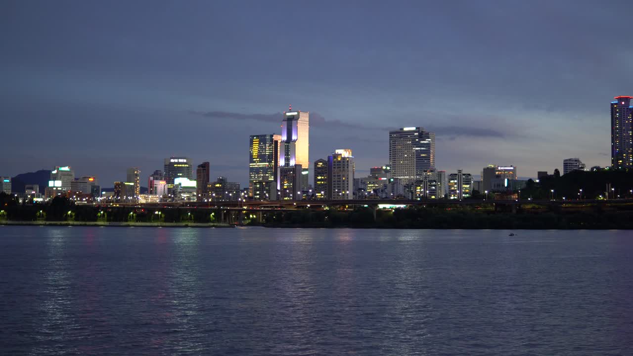 Seoul City Skyline - ASEM And Trade Towers With Colourful Lights At Night From Han River In South Korea. - wide shot