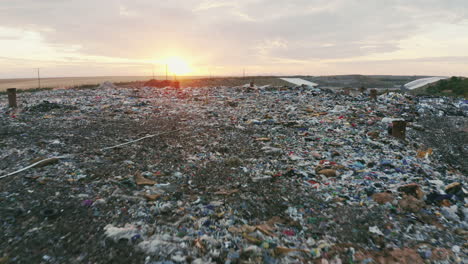 High-quality-footage-of-landfill-with-flyover-geomembrane,-drone-cruising-over-garbage-trucks-and-tractors-operating,-nature