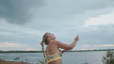 serve-in-beach-volleyball-match-female-player-is-striking-on-ball-slow-motion-portrait-on-open-court-at-nature