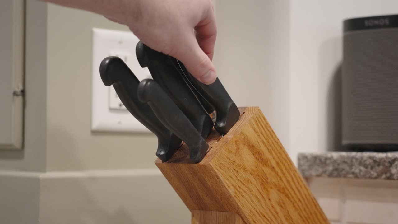 Placing a Large Knife back in slow motion.