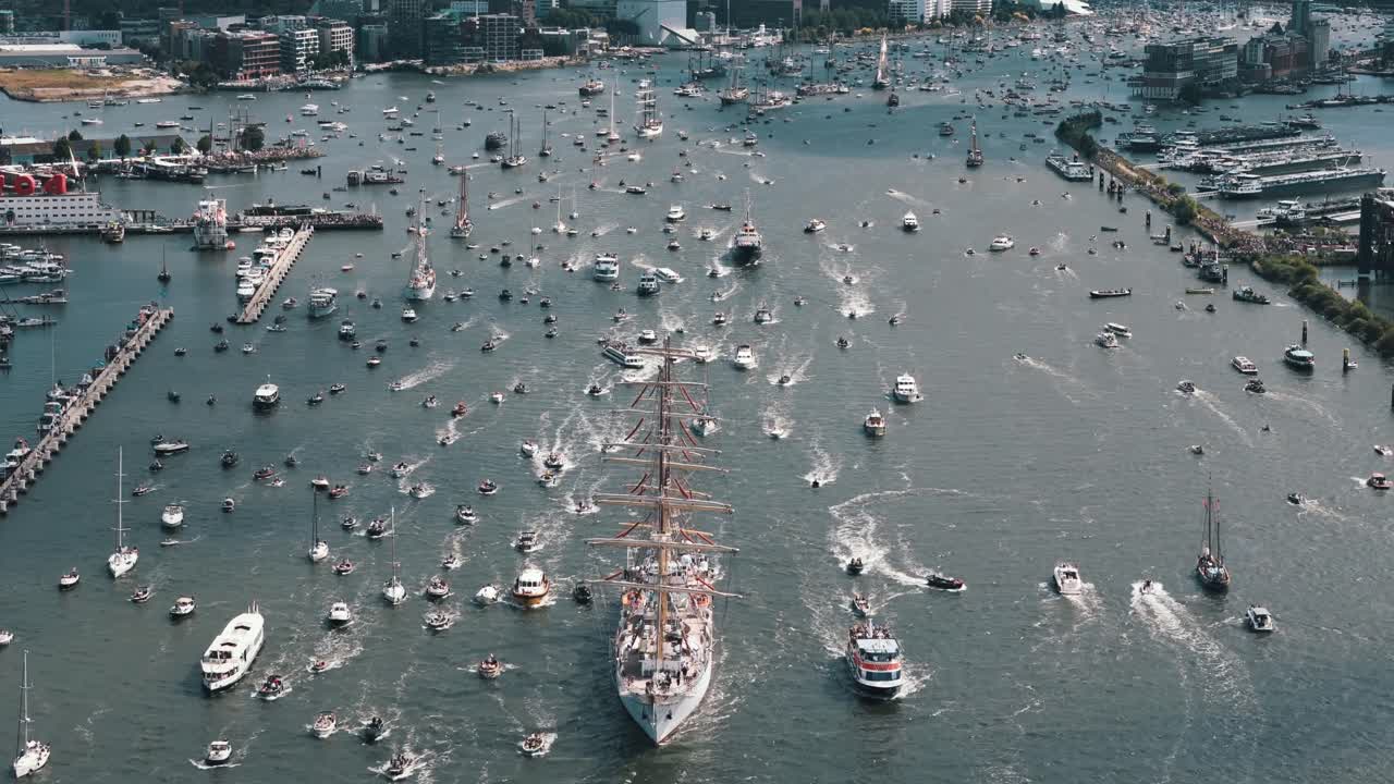 A giant ship leads the Amsterdam sail-out parade on the final morning