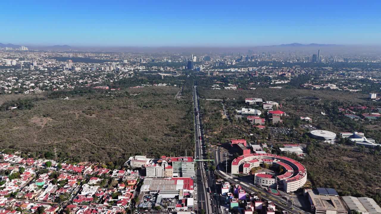 Drone footage of Insurgentes Avenue passing through Ciudad Universitaria in southern Mexico City