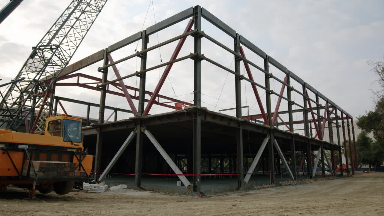 Steel Frame Building Under Construction with Crane
