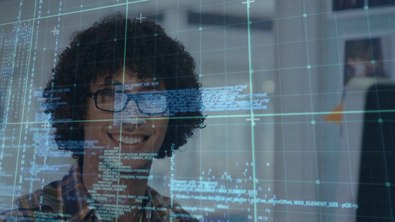 Developer scanning code on monitor, reading code overlay and typing while debugging, smiling