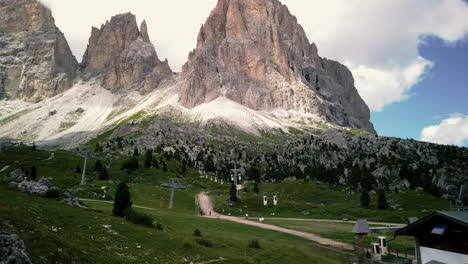 time-lapse of the sassolungo - lankofel gondola - cable cars bringing hikers on the summit of the mountain in the italian dolomites