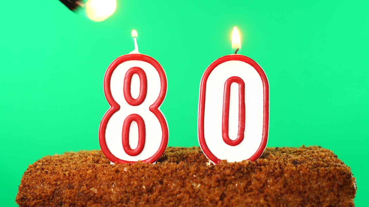 Cake with the number 80 lighted candle. Chroma key. Green Screen. Isolated