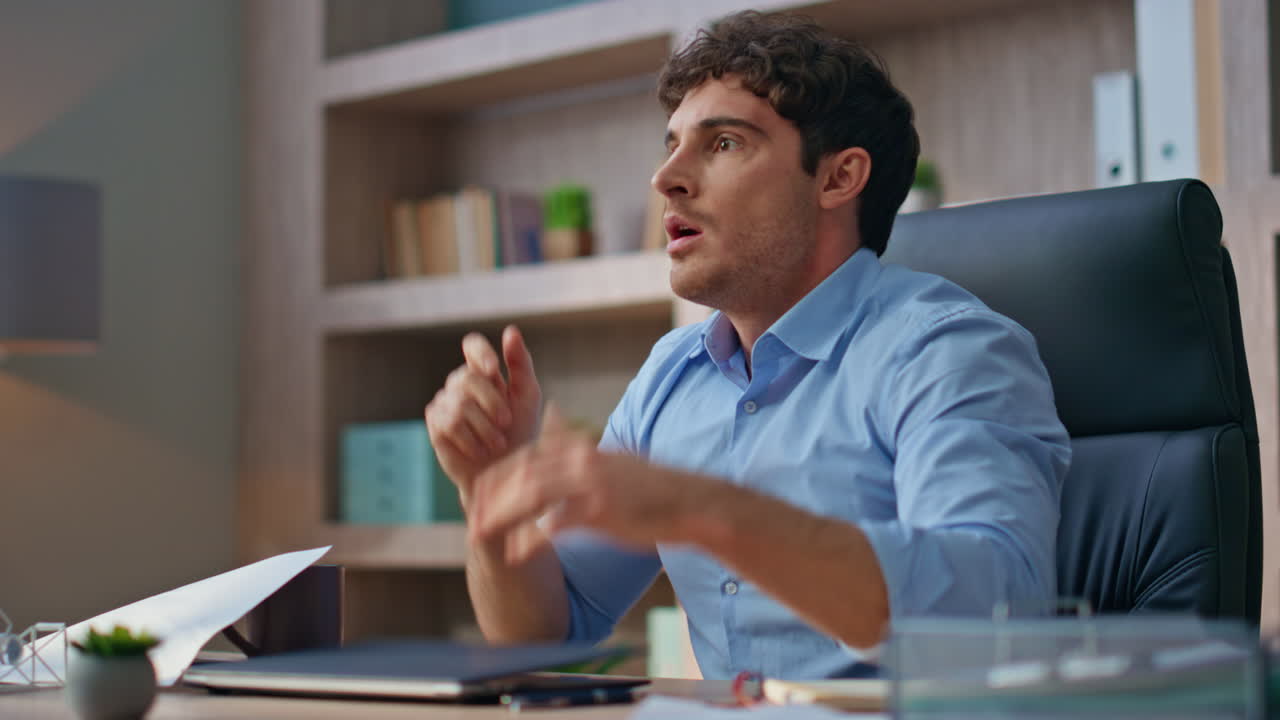 Angry executive video call remotely closeup. Emotional mad manager close laptop