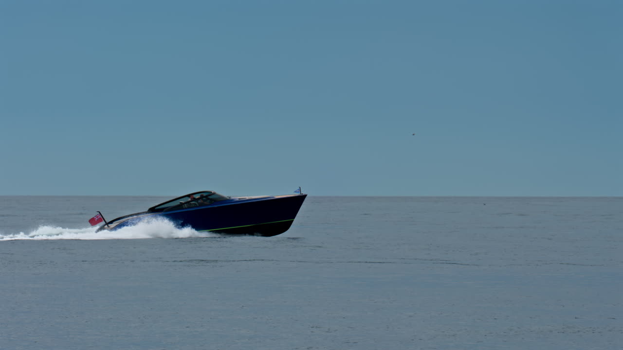View of a boat moving on the Mediterranean Sea in daylight