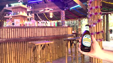 a vibrant bar scene with beerlao bottles