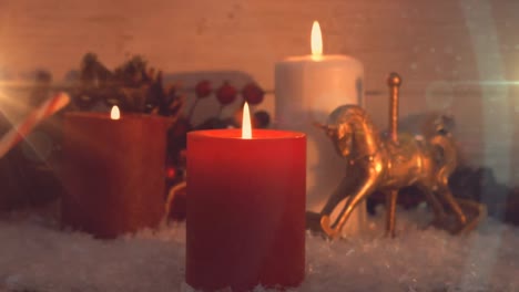 animación de tres velas encendidas y decoraciones navideñas