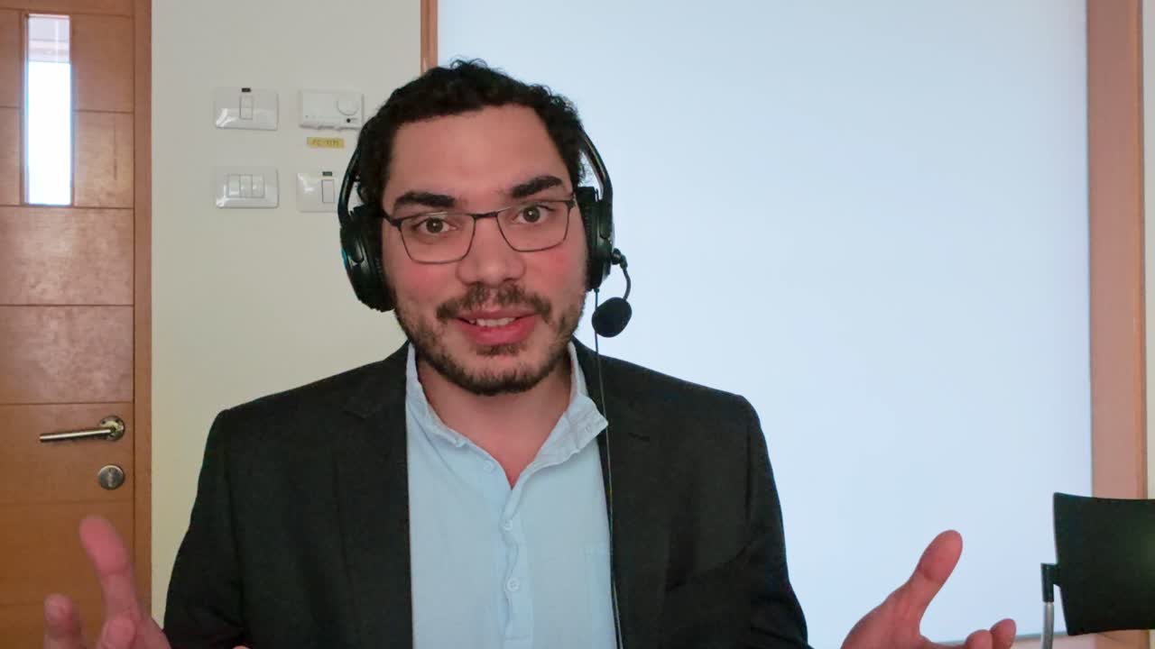 Professional Man Leading a Virtual Team Huddle