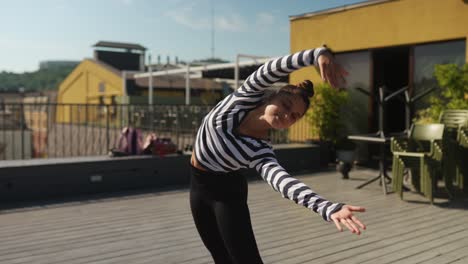 teenager dancing on rooftop