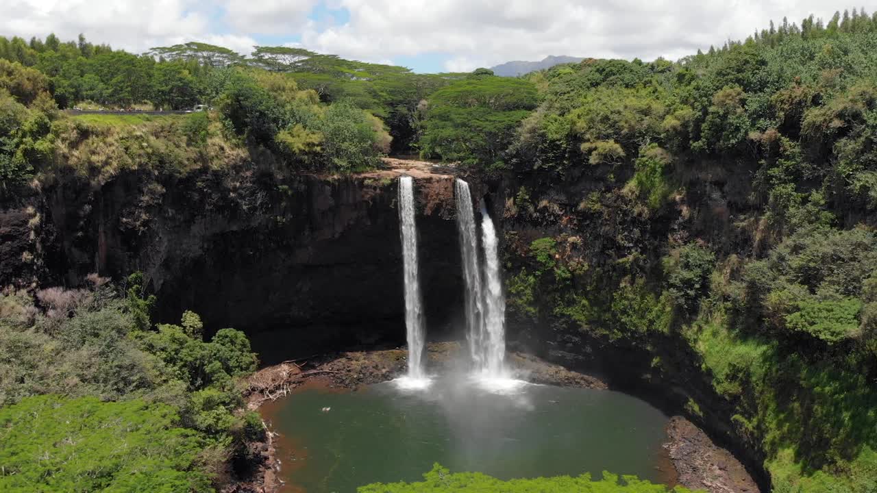 Aerial Dolly Out Movement of Wailua Falls and Wailua State Park in Kauai, Hawaii.