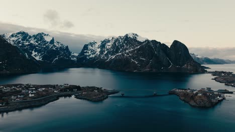 reine, lofoten islands, nordland, norway - dramatic snow-capped peaks, breathtaking rugged landscapes, and picturesque fishing villages unfold - aerial drone shot