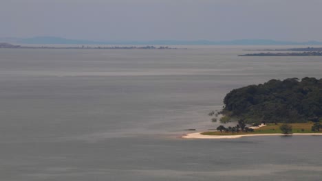 time lapse of archipelago (ssese islands) in lake victoria. view from hill in kalangala, uganda. gusts of wind on water. peninsula, far away islands and horizon showing