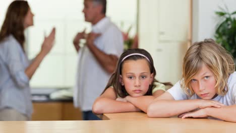 Animation-of-sad-children-at-home-with-parents-in-background