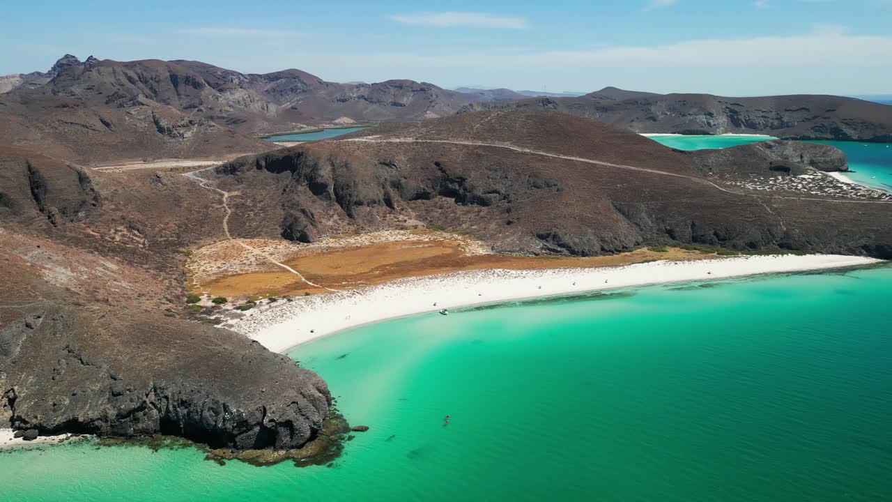Tecolandra beach with turquoise water and scenic rocky landscape, aerial view