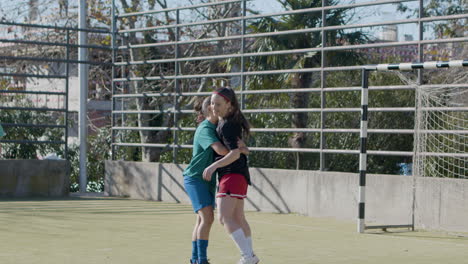 young female football players enjoying freestyle soccer