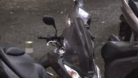 motorbikes for food delivery in the rain on a winter day in lisbon