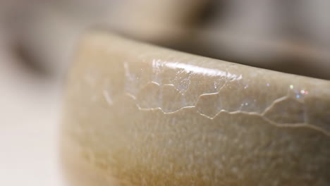 close-up of ceramic object with cracked glaze