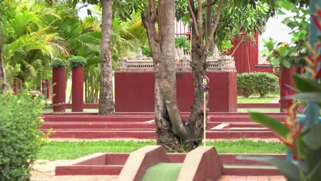 mini golf course surrounded by tropical plants and greenery