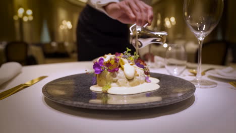 gourmet dish being served in an upscale restaurant