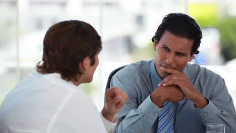 Two-businessmen-talking-together