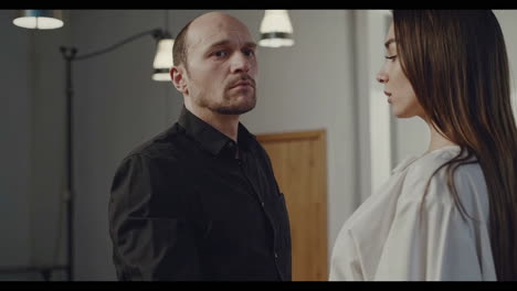 woman drinking coffee, man and woman looking at each other