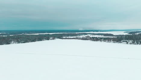 wide scenery shot of a ice road, a path on frozen lake or sea ice used to travel fast via car or walking across the frozen water