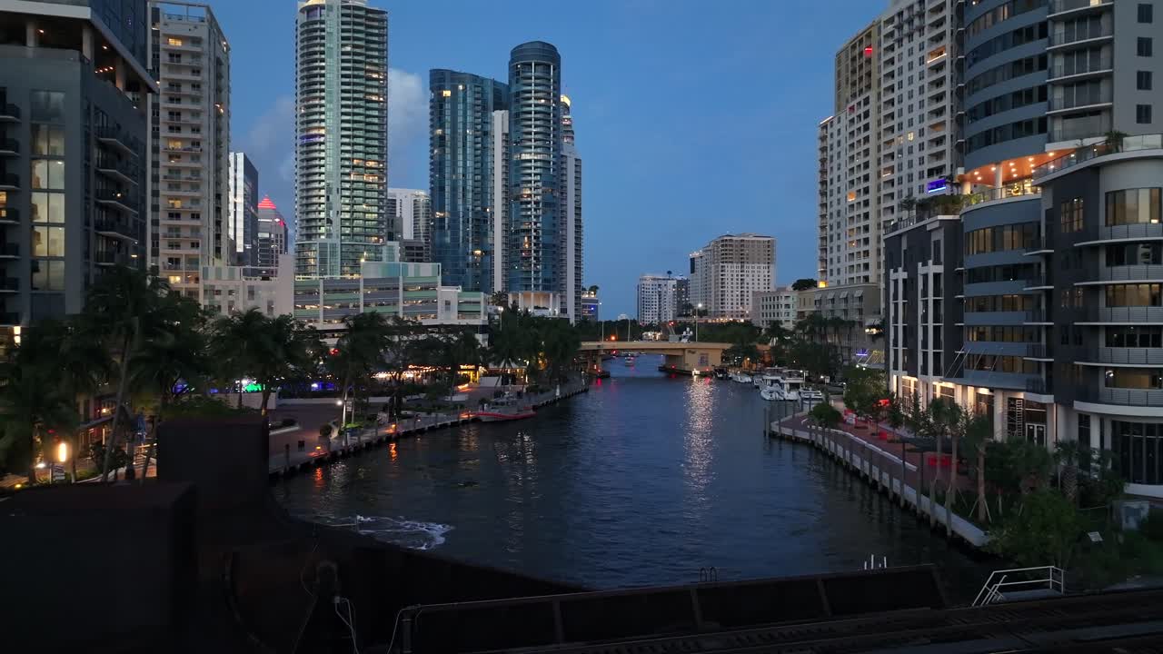 Dusk View of a City River with Illuminated Skyscrapers