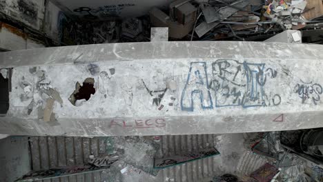 aerial birds eye flying over abandoned broken building