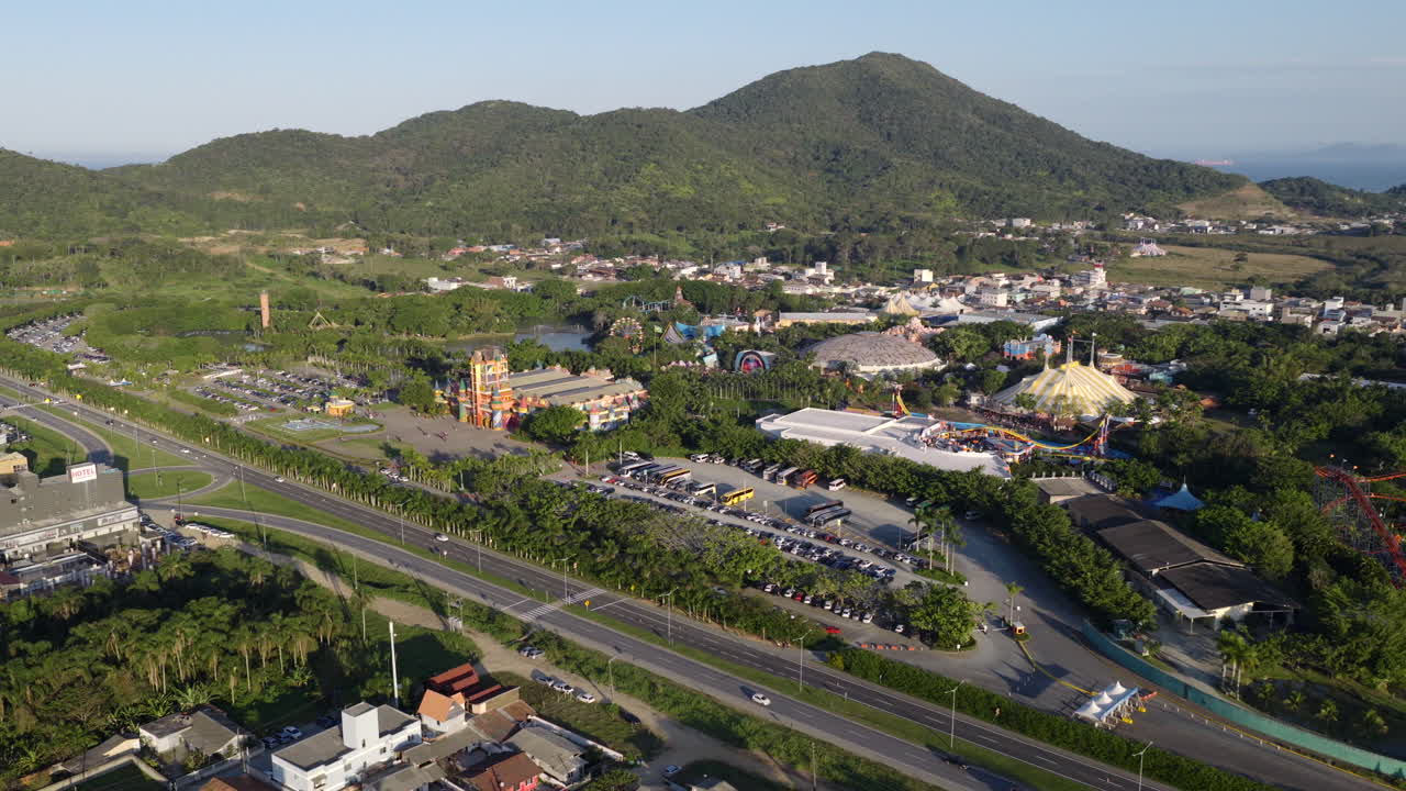 Left-tracking drone shot over Beto Carrero under afternoon sun