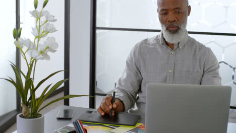 businessman using graphic tablet on desk 4k