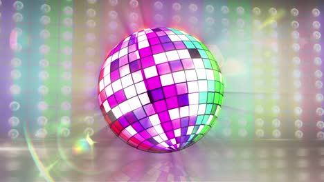 bola de discoteca girando con la bandera del orgullo gay