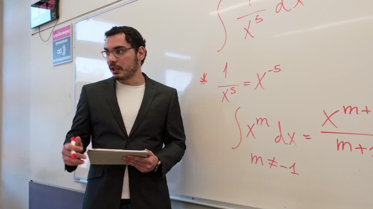 University Professor Teaching Calculus with a Tablet
