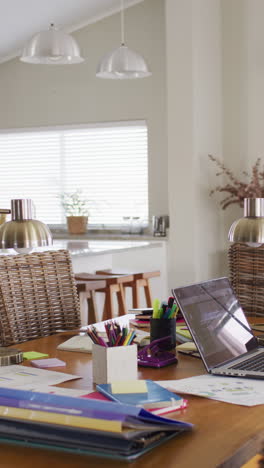 vertical video of interiors with kitchen and table in dining room in slow motion