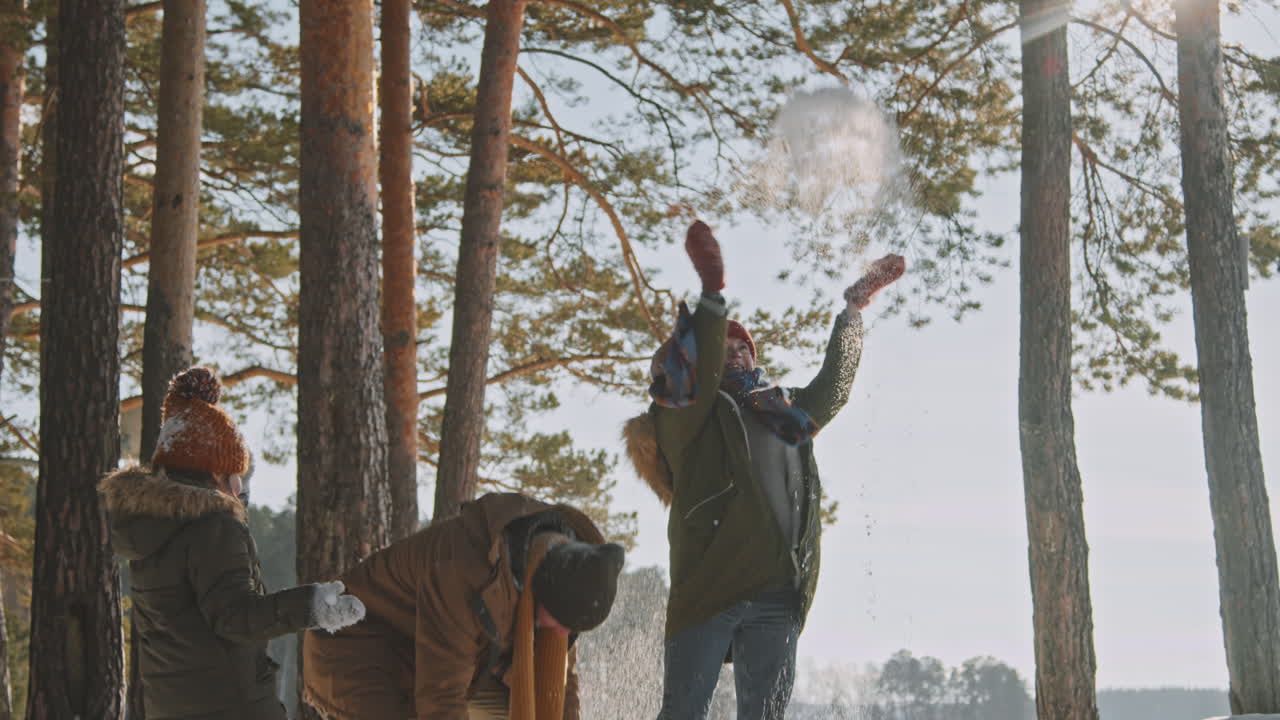 Family Throwing Snow Outside