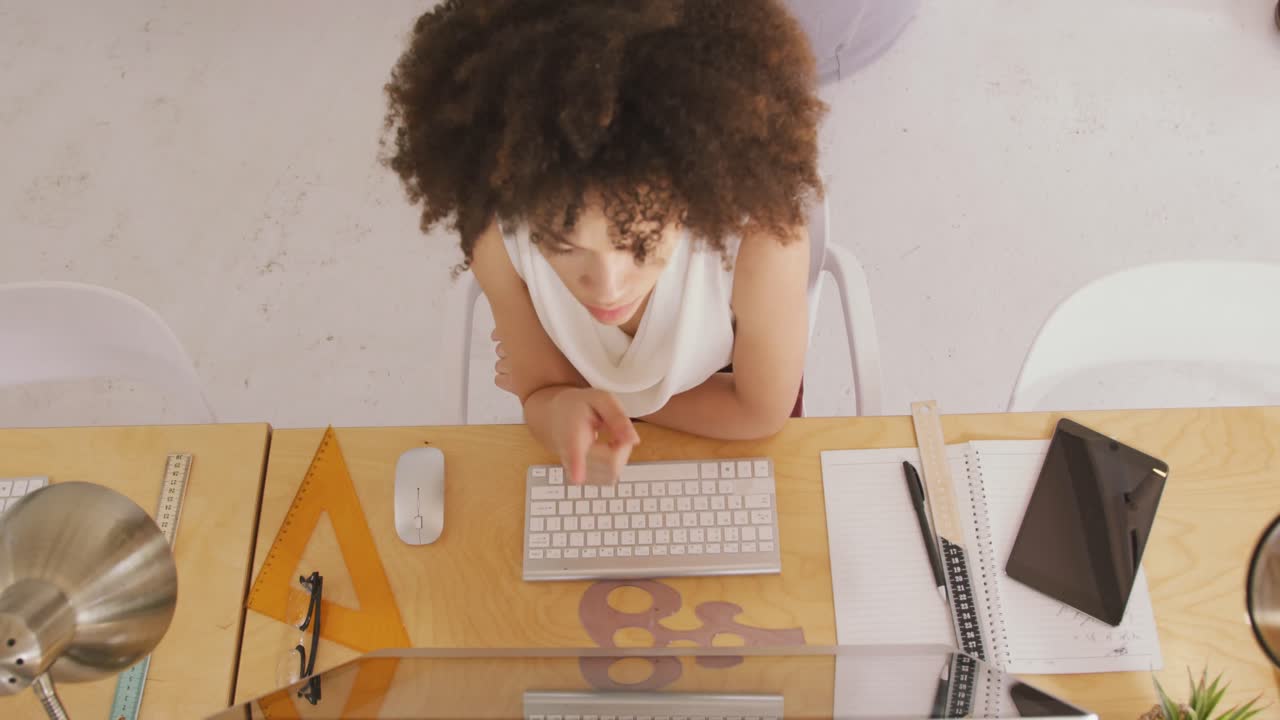 View from above of woman working in creative office