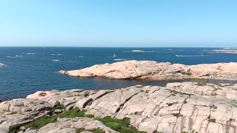 calm blue sea with huge granite rocks on a sunny day