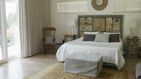 empty house interior with chairs, decorations and bed in bedroom