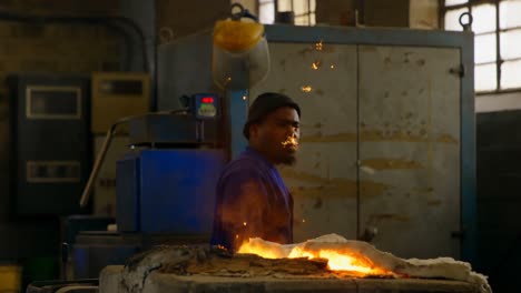 Metal-being-melted-in-furnace-at-workshop-4k