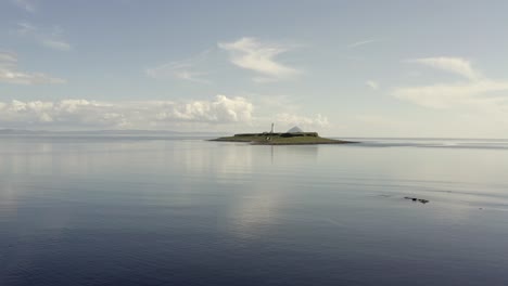 aerial view of pladda lighthouse on the isle of arran on a sunny day, scotland