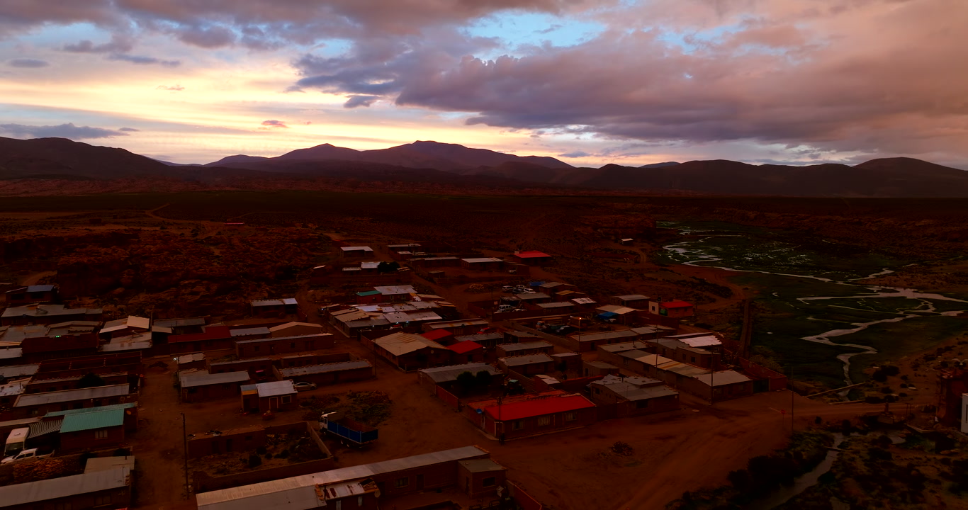 Vivid sunset aerial over remote town Aguas Calientes in Bolivia, South America