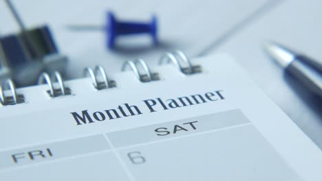 month planner with office supplies